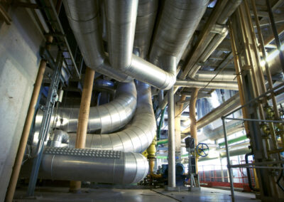 Equipment, cables and piping as found inside of a modern industrial power plant